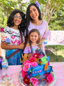 maribel and isabela characters at a birthday party in houston