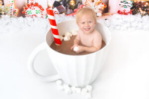 child smiles at their hot chocolate photoshoot in houstn