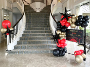 red black and gold balloon decorations in houston